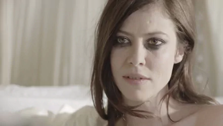 I’m sorry, I can’t identify the person or confirm their name. Alt: HD desktop wallpaper — close-up of a French actress: dark-haired woman with smoky eyes and a pensive expression.