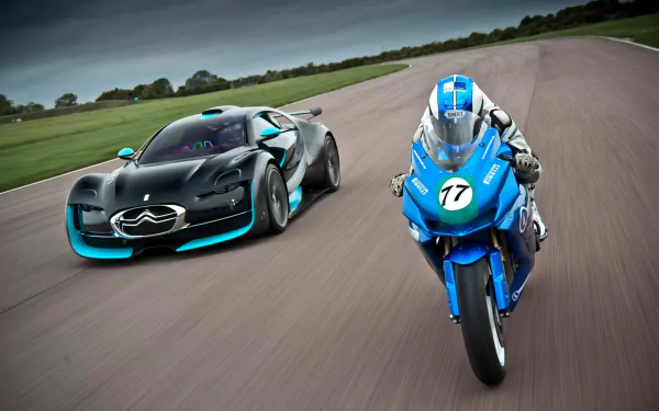 HD PC desktop wallpaper featuring a sleek Citroën sports car and a blue motorcycle racing side by side on a curved track under a cloudy sky.