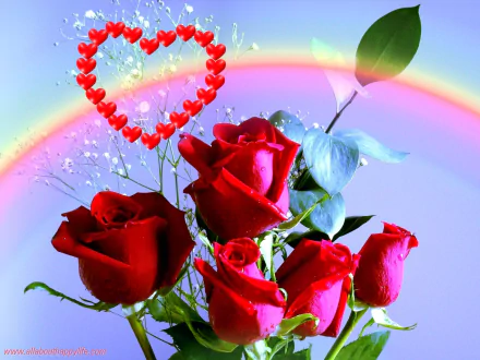 HD desktop wallpaper featuring a bouquet of vibrant red roses, a decorative heart made of smaller hearts, and a colorful rainbow in the background, evoking feelings of love and romance.
