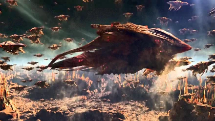 Ender's Game movie 2K Quad HD PC desktop wallpaper: massive alien mothership leading swarms of smaller ships above a scorched, rocky landscape with dramatic cinematic lighting.