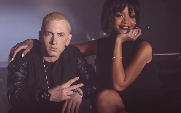 Eminem poses confidently with Rihanna in this vibrant HD wallpaper, capturing the essence of their musical collaboration and iconic styles.