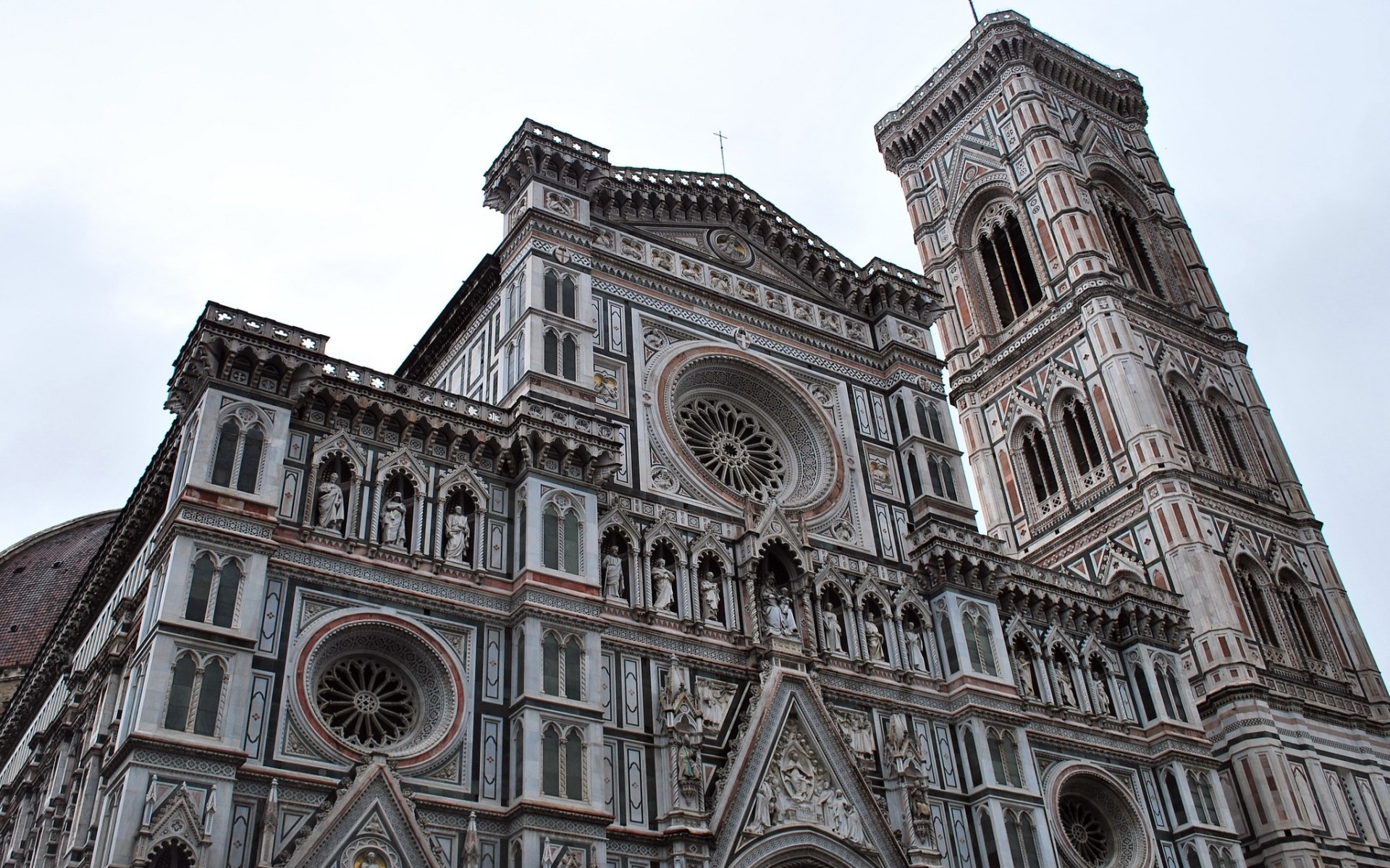 HD desktop wallpaper showcasing the intricate facade and towering bell tower of the Basilica of Saint Mary of the Flower, a renowned religious landmark.