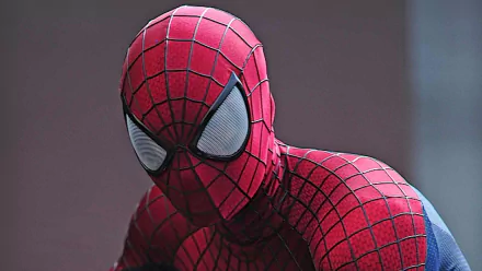 HD desktop wallpaper featuring Spider-Man from the movie The Amazing Spider-Man 2 in his iconic red and blue suit with white eye lenses against a neutral background.