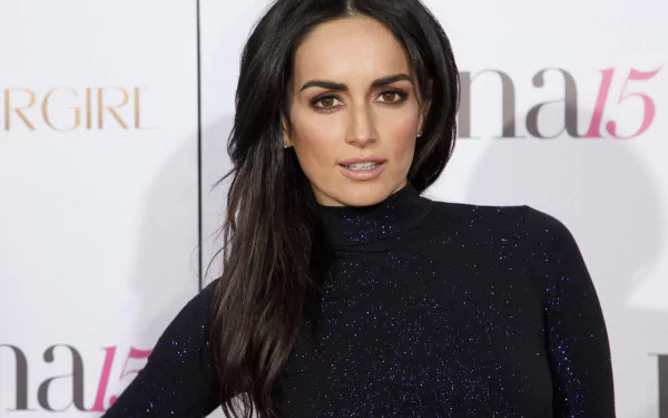 Ana de la Reguera, a talented Mexican actress, poses in a shimmering black outfit at an event, showcasing her elegance and style in this HD desktop wallpaper.