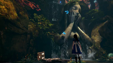 A serene scene from the video game *Alice: Madness Returns*, featuring Alice in a lush setting with a large, emotional statue and butterflies near a cascading waterfall.