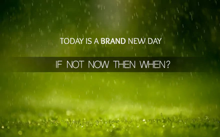 A motivational HD desktop wallpaper featuring the quote, Today is a brand new day. If not now, then when? against a backdrop of rain on green grass.