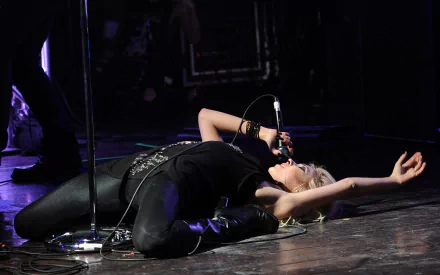 Taylor Momsen passionately performing on stage, captured in a dynamic pose with microphone, rendered in HD for a music-themed PC desktop wallpaper.