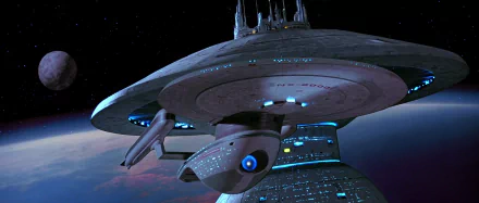 HD PC desktop wallpaper featuring the starship Enterprise from the Star Trek Generations movie, set against the backdrop of space and a distant planet.
