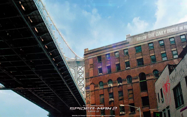 HD desktop wallpaper and background scene from the movie The Amazing Spider-Man 2, featuring a cityscape with a bridge and brick buildings on a clear day.