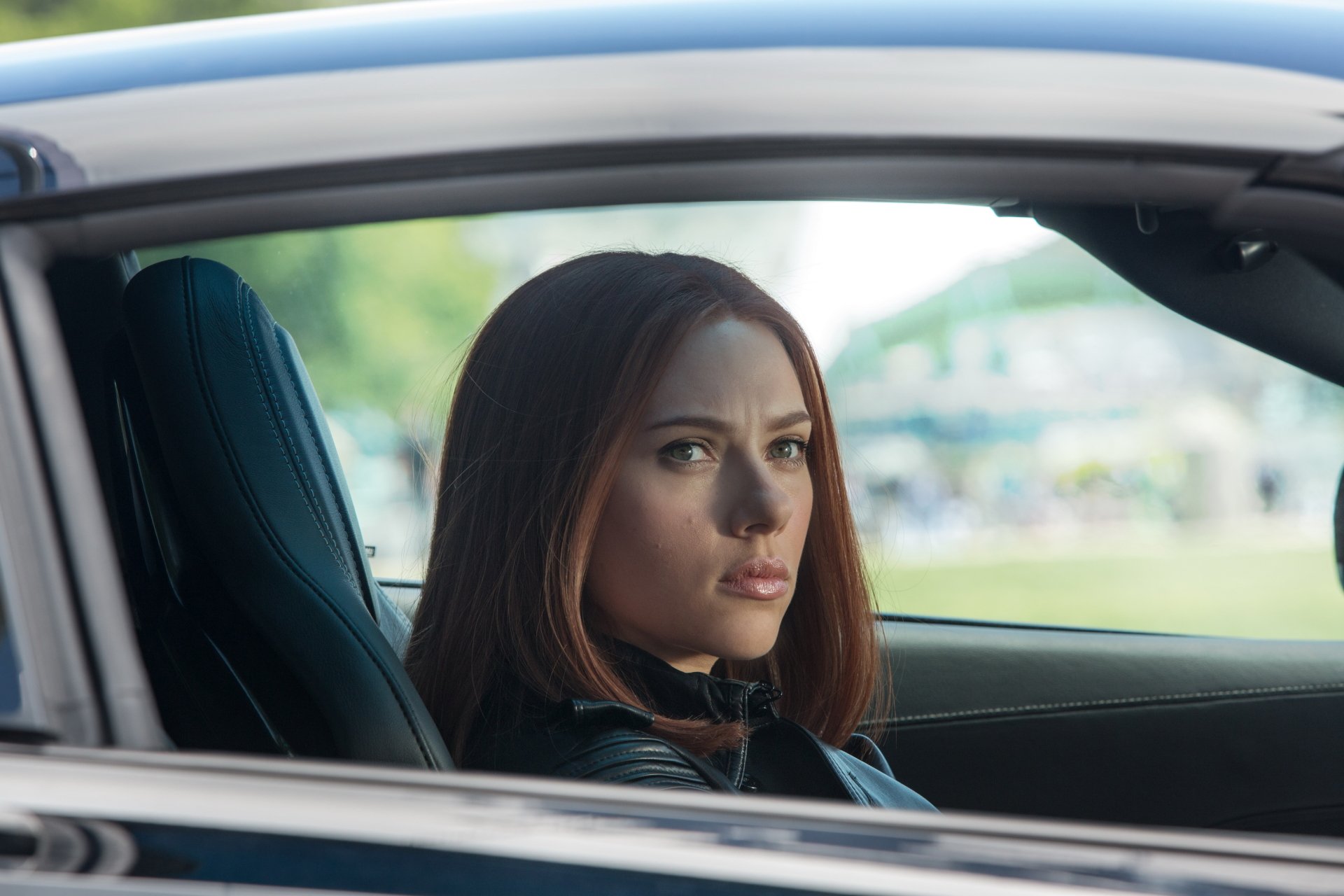 Scarlett Johansson as Black Widow in a scene from *Captain America: The Winter Soldier*. An intense moment captured in this HD desktop wallpaper.