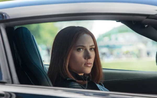 Scarlett Johansson as Black Widow in a scene from *Captain America: The Winter Soldier*. An intense moment captured in this HD desktop wallpaper.