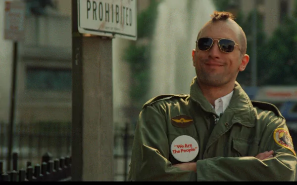 A striking HD desktop wallpaper featuring Robert De Niro as Travis Bickle in Taxi Driver, showcasing his iconic look with a mohawk, sunglasses, and defiant expression.