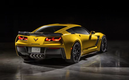 Gold Chevrolet Corvette Z06 sports car rear three-quarter view on dark reflective floor — high-resolution 2K Quad HD PC desktop wallpaper and vehicle background.