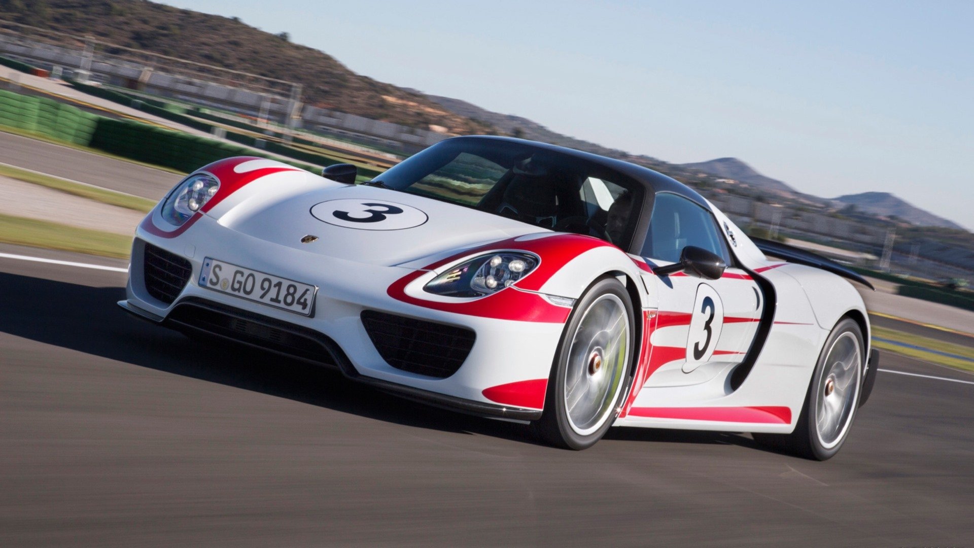 HD PC desktop wallpaper background: Porsche 918 Spyder in white with red livery and number 3, speeding along a racetrack.