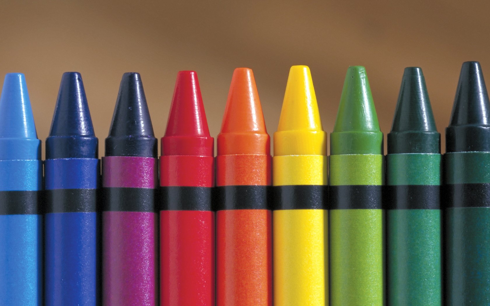 A vibrant arrangement of crayons in various colors, showcasing artistic expression. This HD desktop wallpaper brings a lively touch to your background.