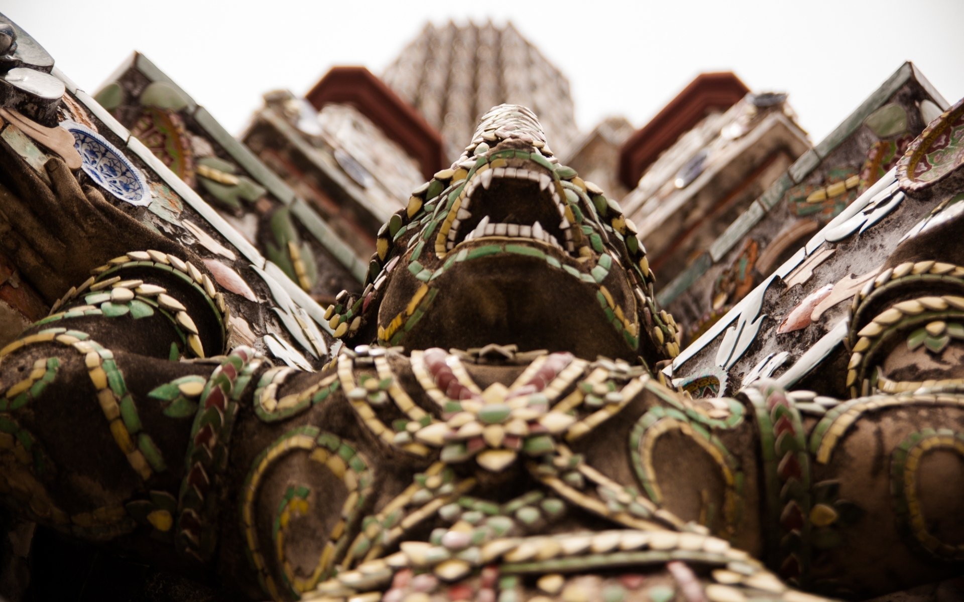 Close-up view of an ornate guardian statue at Wat Arun Temple, showcasing intricate craftsmanship in this HD religious desktop wallpaper.