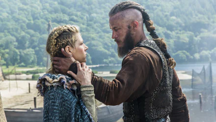Lagertha and Ragnar Lothbrok share an intense moment in this HD wallpaper from the TV show Vikings (2013), set against a stunning natural backdrop.