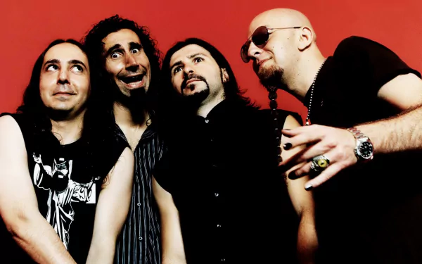 HD desktop wallpaper featuring the band System Of A Down; four members with various facial expressions standing against a red background.