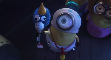 HD PC desktop wallpaper featuring a Minion from the Despicable Me movie holding a blue balloon animal in a dark setting.