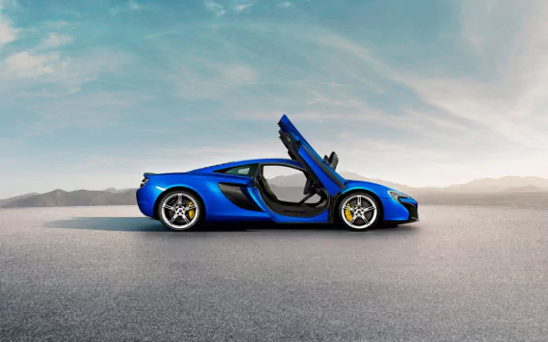 Blue McLaren 650S supercar side profile with dihedral doors open on a wide tarmac beneath a dramatic sky — HD desktop wallpaper background.