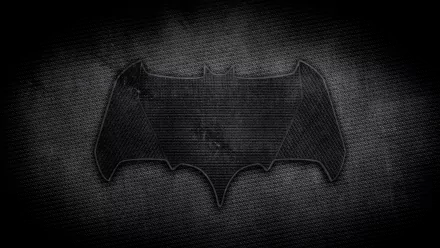 A bold Batman symbol set against a textured dark background, making for a striking HD PC desktop wallpaper that embodies the essence of the iconic comic character.