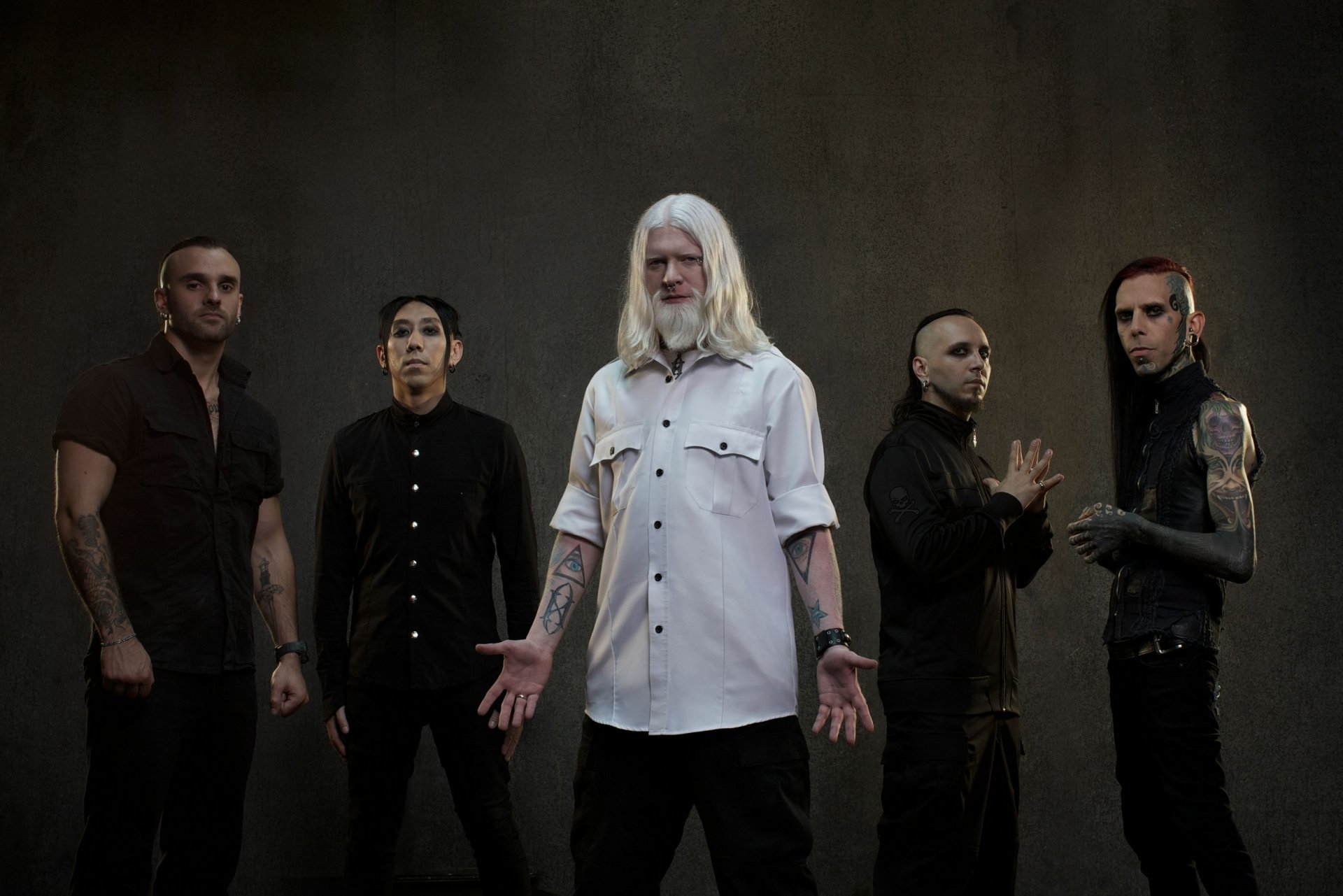 Gemini Syndrome band members posing for an HD desktop wallpaper with a dark, moody backdrop.