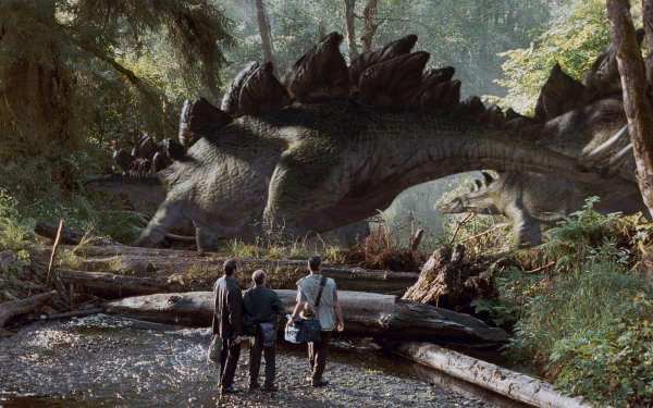 HD PC desktop wallpaper: The Lost World: Jurassic Park — three people at a stream face a towering stegosaurus grazing in a lush, sunlit jungle.