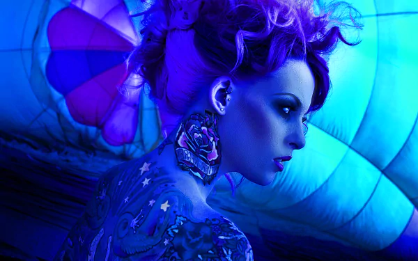 HD fantasy desktop wallpaper featuring a woman with vibrant purple hair, intricate tattoos, and butterfly wings against a glowing blue background.