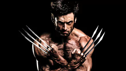 Hugh Jackman as Wolverine, showcasing fierce determination with extended claws, set against a dramatic black background. An engaging HD wallpaper for fans of The Wolverine movie.