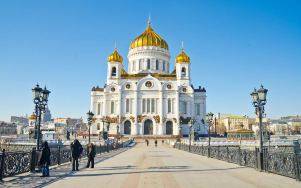 Religious Cathedral of Christ the Saviour framed against a clear blue sky, seen from the entrance bridge; HD PC desktop wallpaper/background.