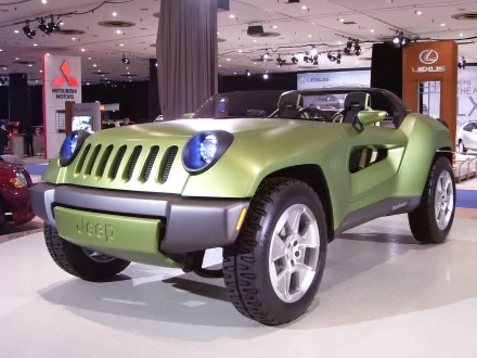 HD desktop wallpaper featuring a 2014 Jeep Renegade Concept, showcasing its bold design and rugged vehicle style in an indoor auto show setting.