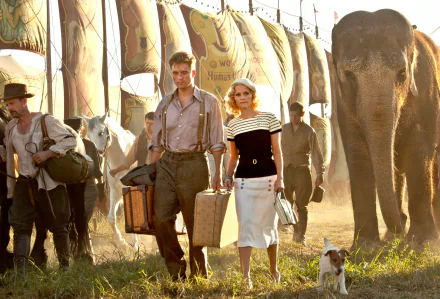 Reese Witherspoon and Robert Pattinson star in a scene from Water for Elephants, featuring a circus backdrop with elephants and travelers, creating a captivating vintage atmosphere.