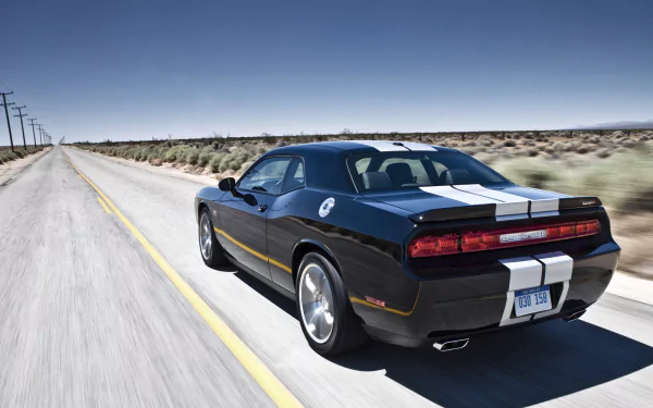 HD PC desktop wallpaper of a black Dodge Challenger SRT8 392 with white racing stripes driving down an empty desert highway.