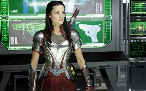 Jaimie Alexander as Sif from Marvel Comics in Agents of S.H.I.E.L.D., shown in armor standing in a high-tech control room, HD desktop wallpaper.