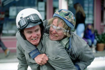 HD desktop wallpaper from Dumb and Dumber To showing two comical characters in quirky helmets, sharing a playful and silly moment.