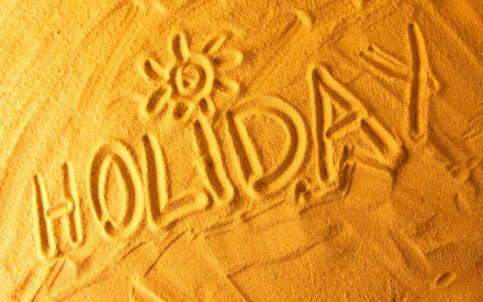 A vibrant artistic HD wallpaper depicting the word HOLIDAY drawn in sand with a sun symbol, capturing the essence of summer. Bright yellow tones create a warm and inviting atmosphere.