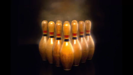 HD desktop wallpaper featuring a close-up of wooden bowling pins arranged in a triangle under soft lighting, highlighting the sport of bowling.