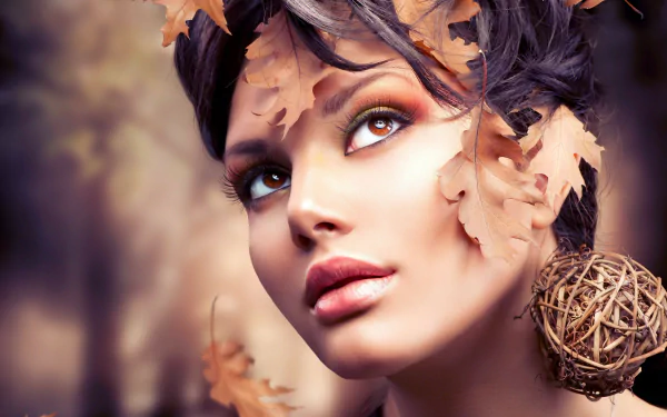 HD PC desktop wallpaper featuring a close-up of woman Judy Wilkins adorned with autumn leaves and a natural, artistic headpiece.