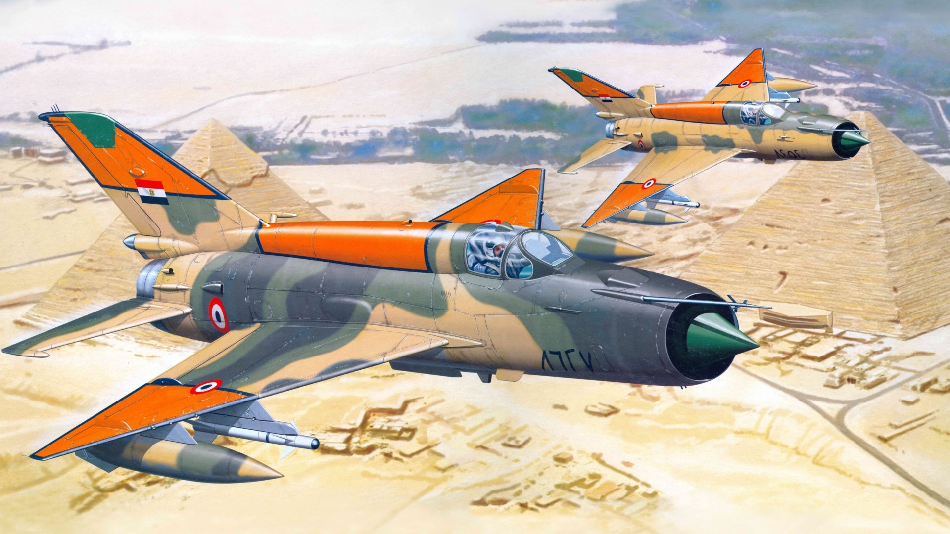 Two Mikoyan-Gurevich MiG-21 military jets with orange accents flying over desert terrain, rendered in 8K Ultra HD as a desktop wallpaper.