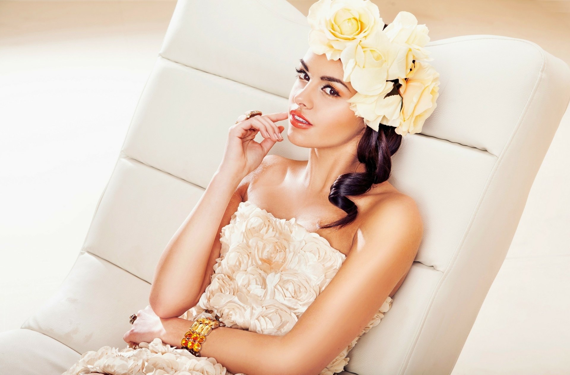 HD PC desktop wallpaper featuring model Anita Sikorska in a floral dress with matching large flower headpiece, posing elegantly against a soft white background.