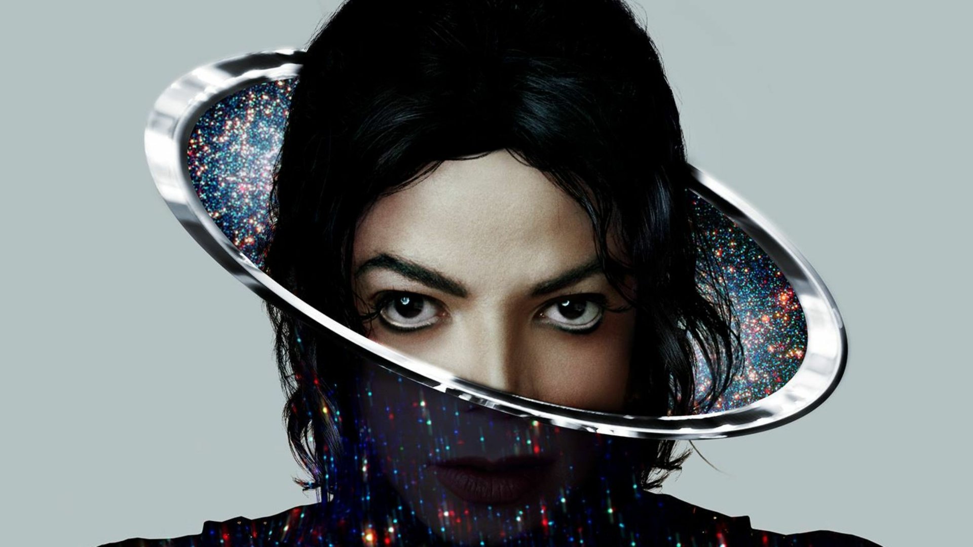 A striking HD wallpaper featuring Michael Jackson's face framed by a cosmic halo, blending elements of music and space, capturing his iconic presence and artistry.