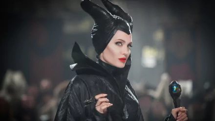 Angelina Jolie portrays Maleficent in this striking 4K Ultra HD wallpaper, showcasing her iconic dark attire and captivating presence in the film.