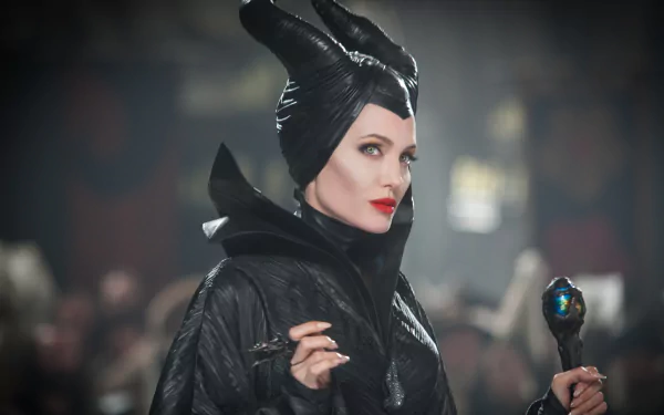 Angelina Jolie portrays Maleficent in this striking 4K Ultra HD wallpaper, showcasing her iconic dark attire and captivating presence in the film.