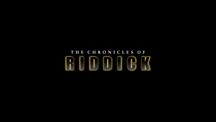 HD PC desktop wallpaper featuring the title logo of the movie The Chronicles of Riddick on a black background.