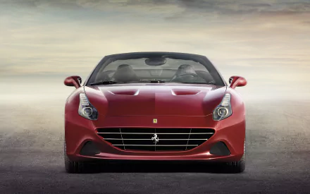 HD desktop wallpaper featuring a sleek red Ferrari California T parked with a subtle cloudy sky backdrop.