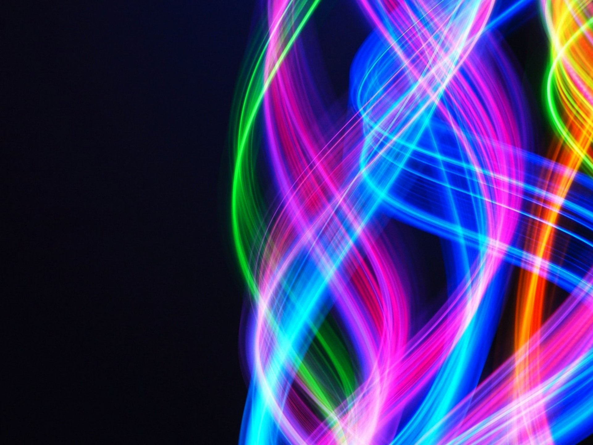 Vibrant pastel-colored abstract light streaks swirl against a dark background, creating a dynamic HD PC desktop wallpaper with vivid, flowing colors.