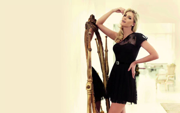 A stylish Brazilian woman, Ana Hickmann, poses elegantly in a black dress beside a decorative mirror. The image serves as an HD desktop wallpaper and background.