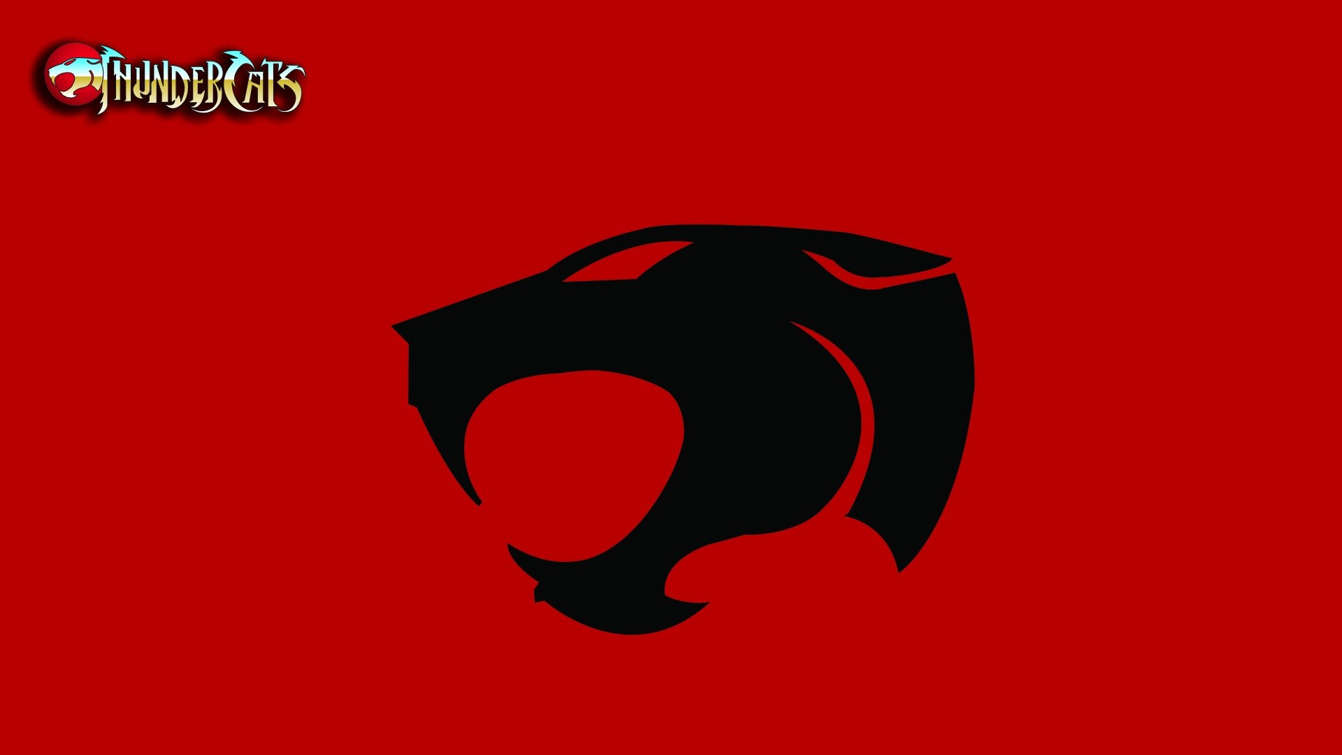 Thundercats (1985) logo in bold black silhouette on a red background, presented as an 8K Ultra HD PC desktop wallpaper from the classic TV show.