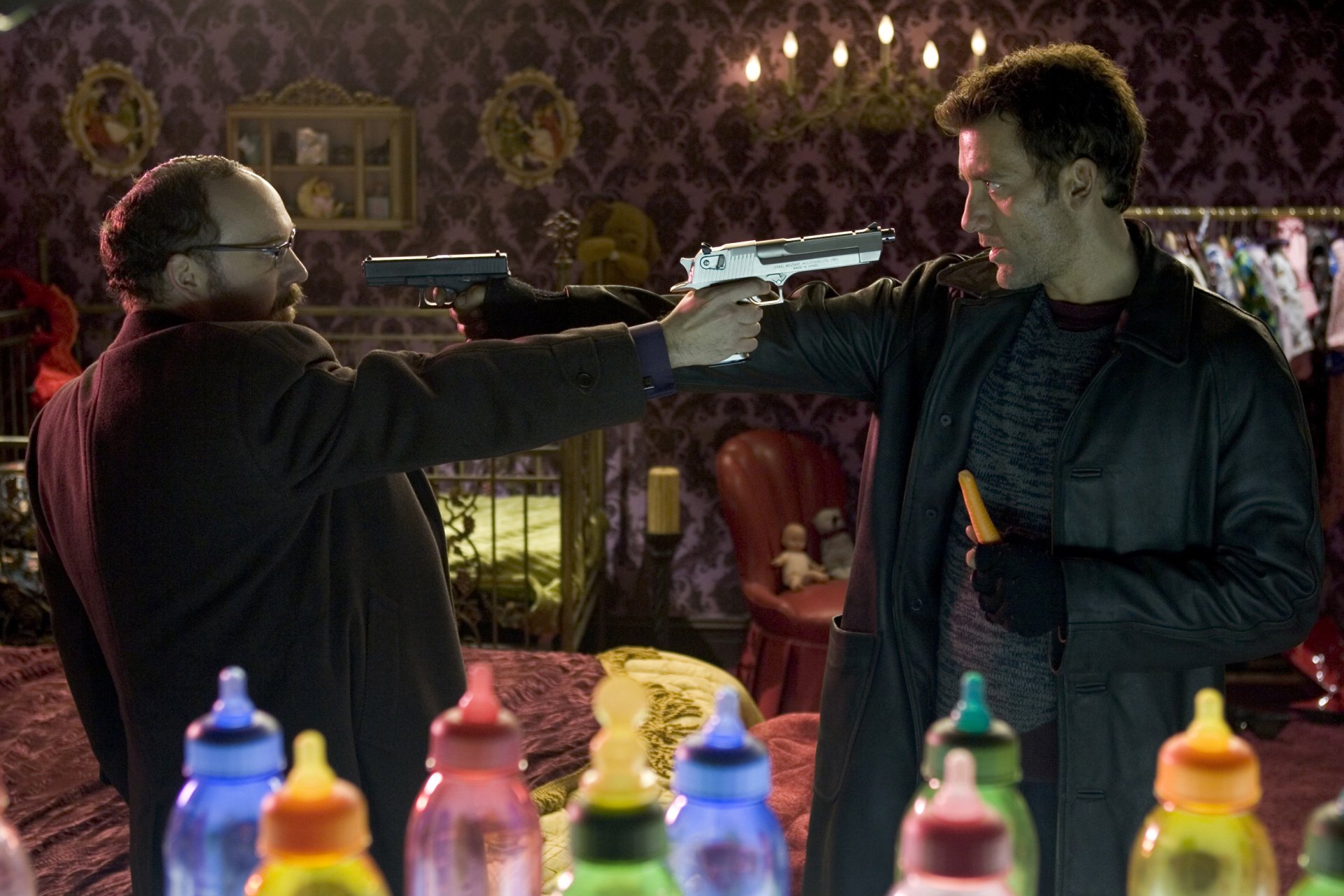 HD PC desktop wallpaper featuring a tense standoff scene from the movie Shoot 'em Up with Paul Giamatti holding a gun.
