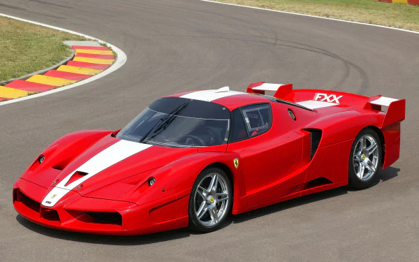 Red Ferrari FXX race car with white stripe racing on a track, captured in high definition for a PC desktop wallpaper and background.